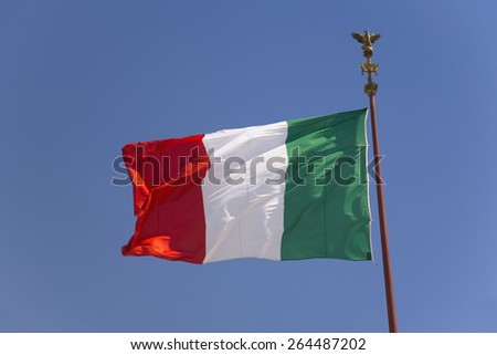 Italian flag flying in blue sky, Rome, Italy, Europe
