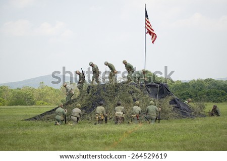 A World War II reenactment of US Marines raising the American flag on Iwo Jima on February 23, 1945 at Mid-Atlantic Air Museum World War II Weekend and Reenactment in Reading, PA held June 18, 2008