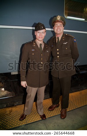 Two 1940\'s male soldiers pose in front of Pearl Harbor Day Troop train reenactment from Los Angeles Union Station to San Diego