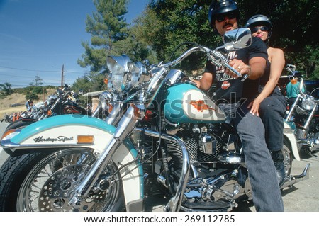 A couple on a Harley Davidson motorcycle, Malibu, CA