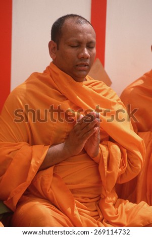 A Buddhist monk meditating, Lotus Festival in Echo Park, Los Angeles, CA