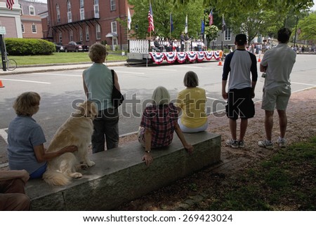 Crowd with dog watches veterans ceremony on Memorial Day, 2011, Concord, MA
