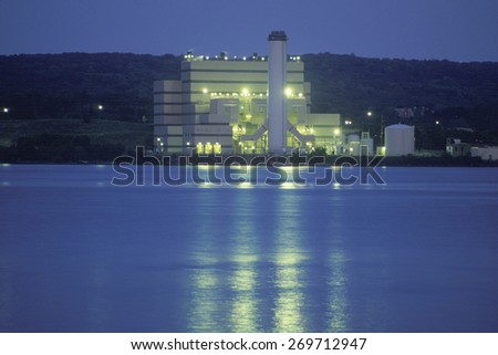 A factory on the Hudson River in New York at night