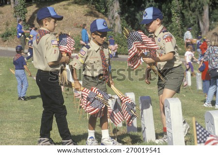Boy Scouts placing flags at a Veteran\'s Cemetery, Los Angeles Veterans Cemetery, CA