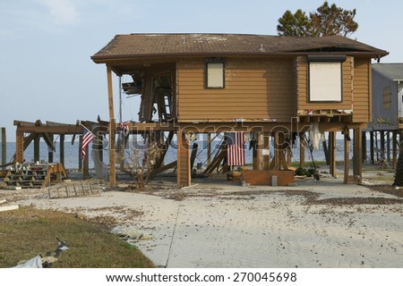 American Flag and destroyed house after Hurricane Ivan hits in Pensacola Florida