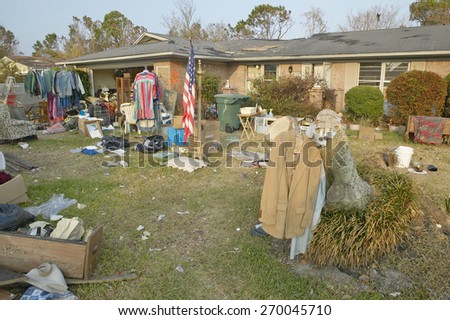 American Flag and debris in front of house heavily hit by Hurricane Ivan in Pensacola Florida