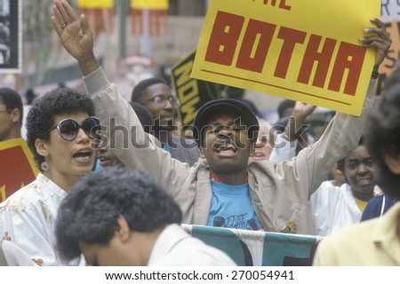 Angry protesters holding sign, Los Angeles, California