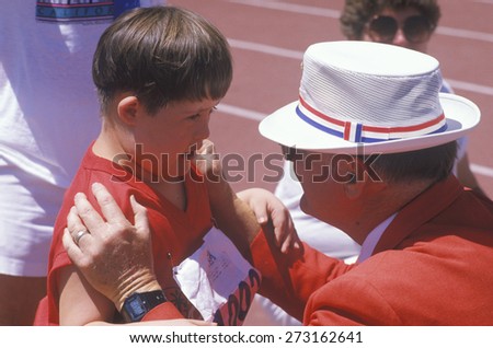 Volunteer coaching handicapped young athlete, Special Olympics, UCLA, CA