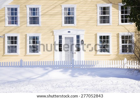 Yellow New England home in fresh snow, Ma., New England, USA