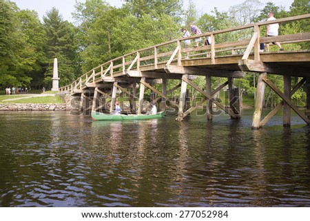 Canoeist paddles under the Old North Bridge, Concert Mass, site of the first American victory in the Revolutionary War on April 19, 1775