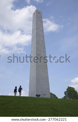 Tourists take picture of Bunker Hill Memorial stands 221 feet tall at Breed\'s Hill, the site of the first major battle of the American Revolution, June 17, 1775, Boston, MA