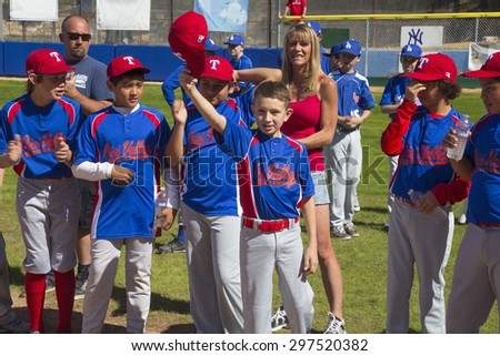 Oak View, California, USA, March 7, 2015, Ojai Valley Little League Field, youth Baseball, Spring, raise their caps when name is announced