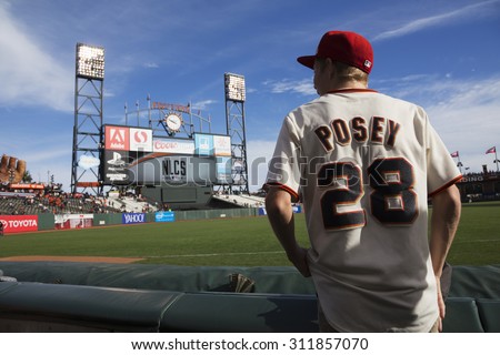 San Francisco, California, USA, October 16, 2014, AT&T Park, baseball stadium, SF Giants versus St. Louis Cardinals, National League Championship Series (NLCS), fan with Posey #28 uniform pre-game