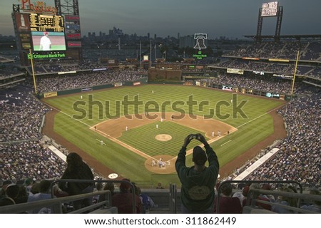 A fan with a digital camera taking a panoramic image of Citizens Bank Park Philadelphia, PA, one of 29183 watching Philadelphia Phillies beat the Milwaukee Brewers by a score of 8 to 6 on May 14, 2007