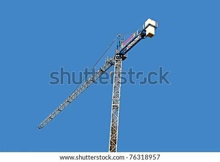 Steel crane, general view over blue sky