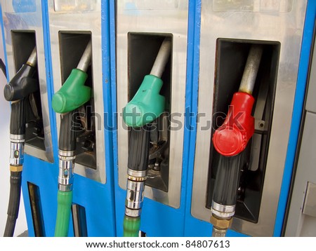 Four petrol pumps, close up