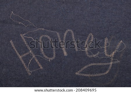 embroidery on denim. inskription honey