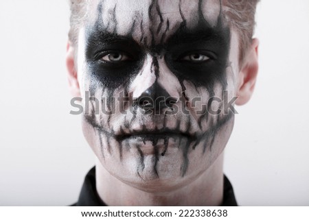 Portrait  man with Halloween skull makeup. Halloween or horror theme