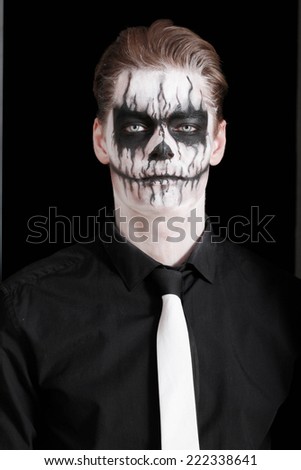 Portrait  man with Halloween skull makeup. Halloween or horror theme