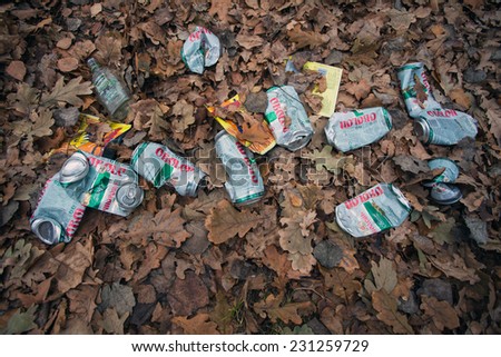 Crumpled empty cans of beer lying on the grass in the park.empty beer cans garbage pollution forest.Belarus,Minsk,November,14,2014