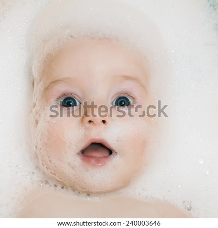 baby in the bathroom to clean the foam