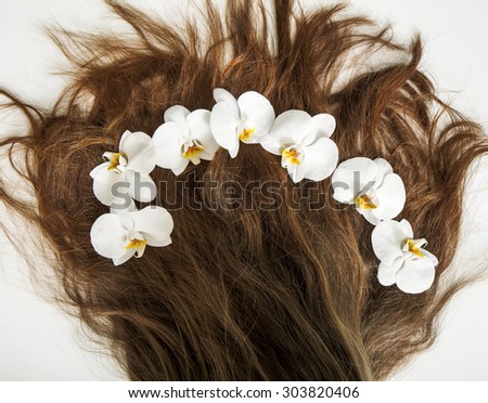 white orchid in female hair