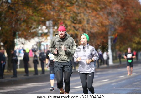 Participants sports. Athletes men and women at the time the Minsk International Marathon. Belarus, Minsk, 13 September 2015