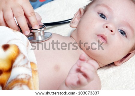 Stethoscope listening to a baby\'s heart beat