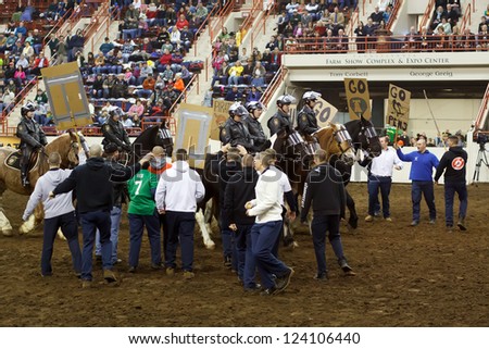 HARRISBURG,PA - JANUARY 5: Pennsylvania State Police demonstrate crowd control tactics with mock protesters in the large arena of the Farm Show Complex on January 05, 2013 in Harrisburg, PA.