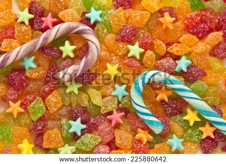 Fruit candy with caramel candy in the shape of stars and striped