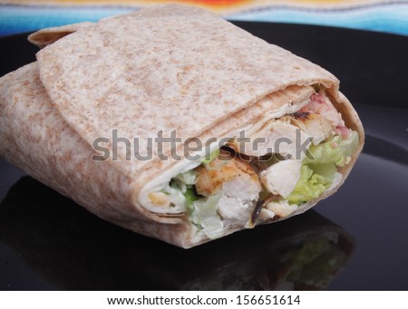 Chicken Wrap / Small Chicken wrap on a black plate. This shot was taken with a Canon Mark II.