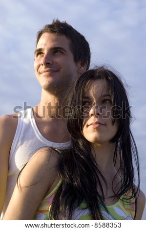 Teenage couple looking ahead
