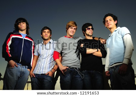 Portrait of young trendy teenager group of friends standing together