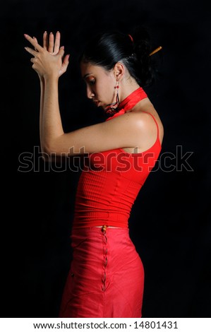 Portrait of hispanic flamenco dancer woman isolated on black