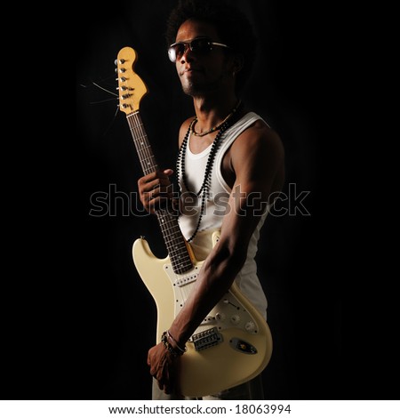 Portrait of young trendy african man holding electric guitar - isolated