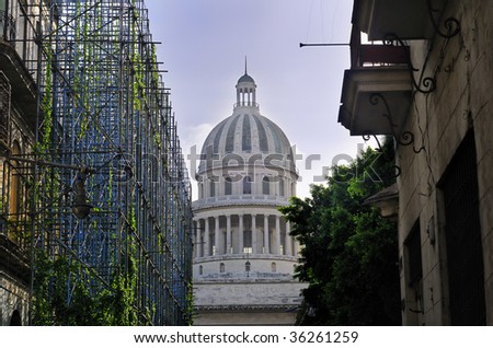 Detail of Havana capitol dome with crumbling buildings in the front