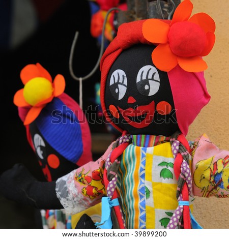 Detail of colorful rag doll souvenir on Havana street