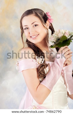 Beautiful woman dressed as a bride over colored background.