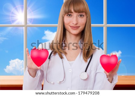 Health insurance or love concept. Doctor holding heart. Concept of medicine, health care, diagnostics.