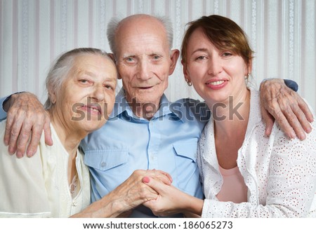 Senior Man, Woman with their Caregiver at Home. Concept of Health Care for Elderly Old People, Disabled.