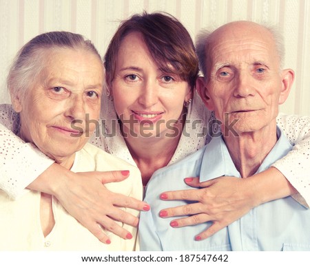 Senior Man, Woman with their Caregiver at Home. Concept of Health Care for Elderly Old People, Disabled.