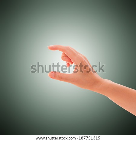 Hand holds virtual credit card, business card, thing. isolated