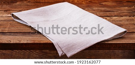 Empty wooden deck with table cloth, napkin over wall background Stok fotoğraf © 