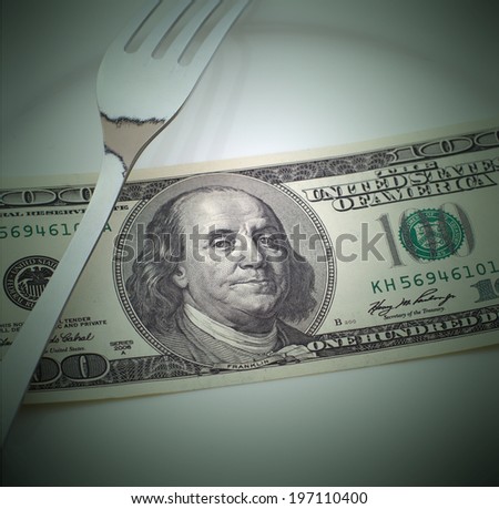 Money cash dollars lying on the plate. Concept you want to eat - go to work
