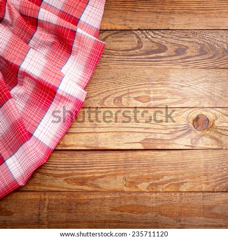 Wood texture, wooden table with red tablecloth tartan top view. Collage for menu