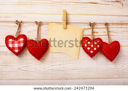Valentines Vintage Handmade Hearts over Wooden Background. Valentine over Wood. Retro Styled Wallpaper. Valentines Day. Paper Tag labeling.
