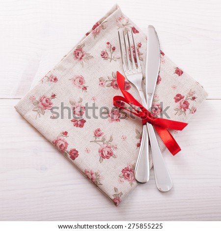 Knife fork on tablecloth. Wooden board. Flat design for menu. Square mock up