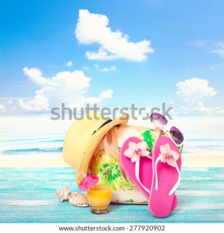 Summer concept of sandy beach, straw hat, shells. Flat mock up for design.