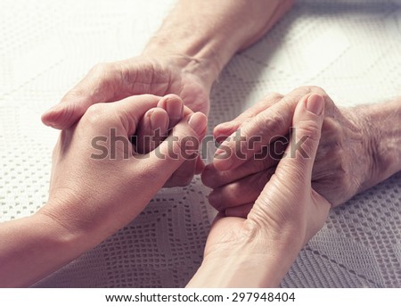 Care is at home of elderly. Space for text. Senior man, woman with their caregiver at home. Concept of health care for elderly old people, disabled. Elderly man.