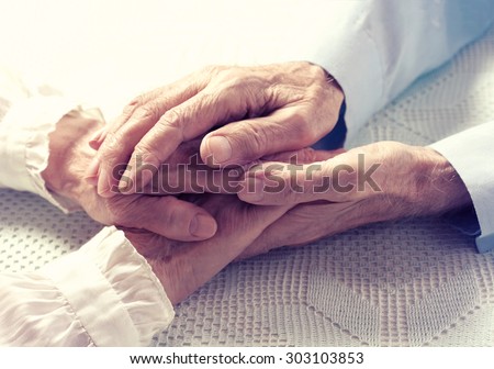 Old people couple holding hands closeup. Happy family.